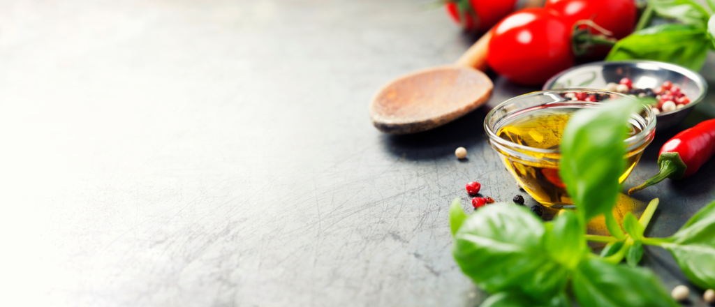 Wooden spoon and ingredients on old background